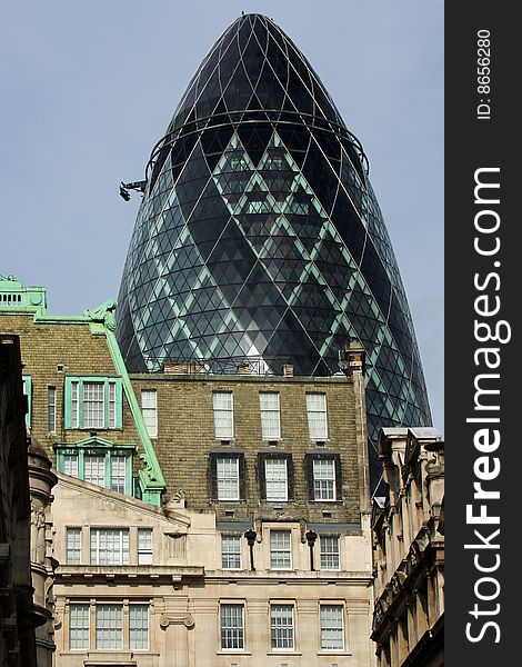 The Gherkin building amongst older buildings. ST Mary Axe