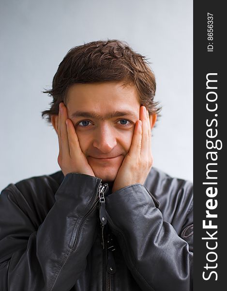 The surprised young man in a black jacket. The surprised young man in a black jacket.