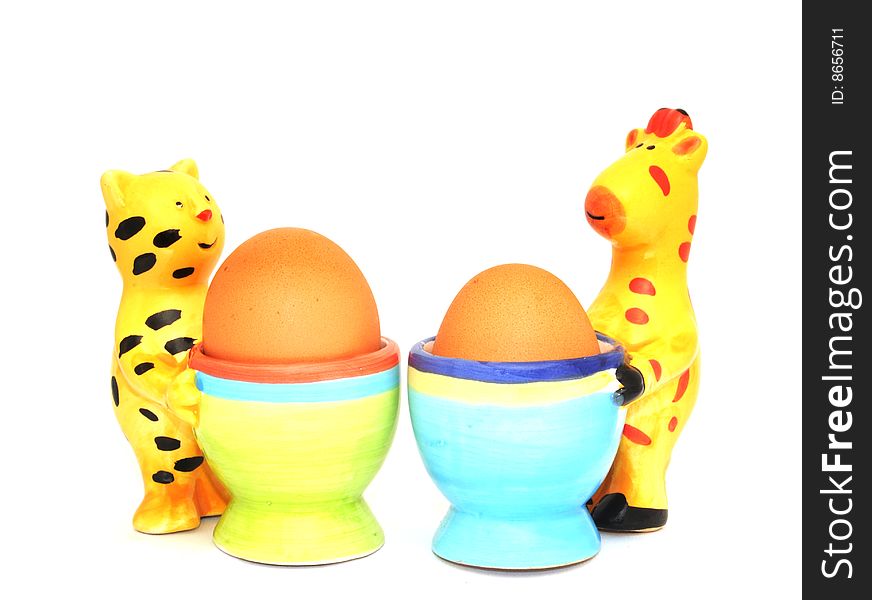 Bright ceramic egg cups with eggs