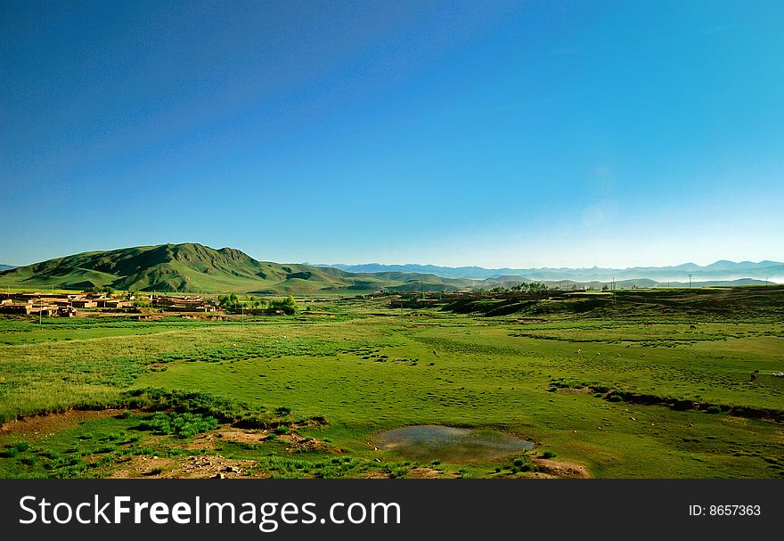 Early morning's sunlight shines in the vast prairie. Early morning's sunlight shines in the vast prairie