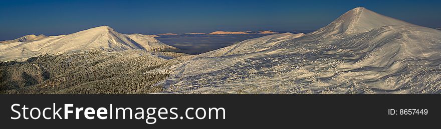 Beautiful panorama of famous Ukrainian mountains Hoverla and Petros in winter. Beautiful panorama of famous Ukrainian mountains Hoverla and Petros in winter