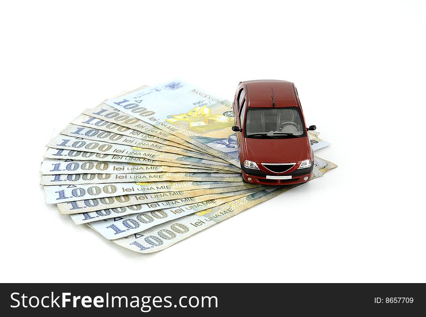 Small car on money against white background. Small car on money against white background