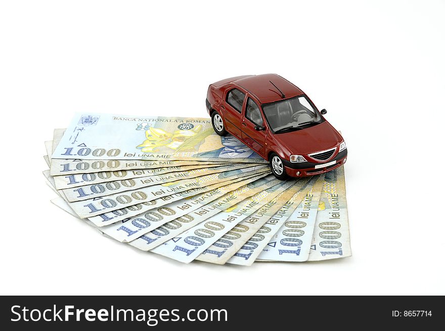 Small car on money against white background. Small car on money against white background