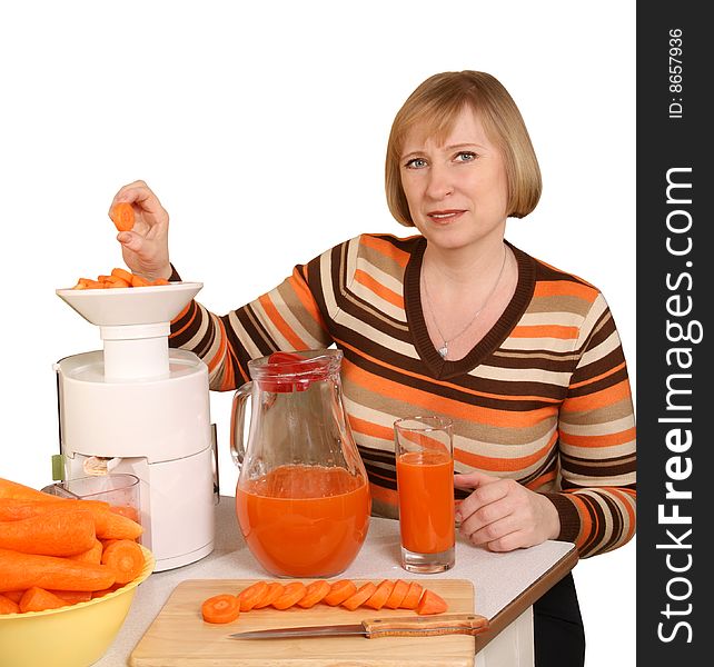 The woman has prepared for juice from carrots. The woman has prepared for juice from carrots