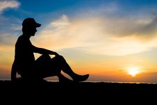 Silhouette Of A Man Sitting Near The Ocean Royalty Free Stock Photos Silhouette Of A Man Sitting Near The Ocean Royalty Free Stock Photos