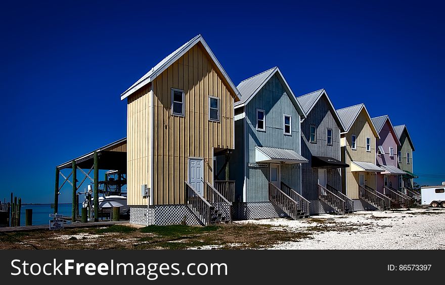 Inline House Near Seashore during Daytime
