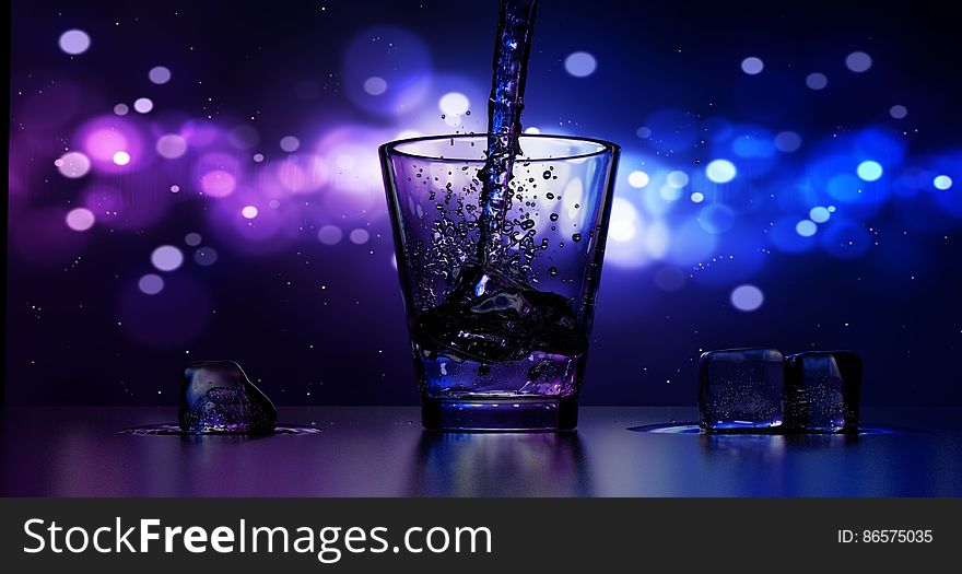 Close-up of Water Splashing in Drinking Glass