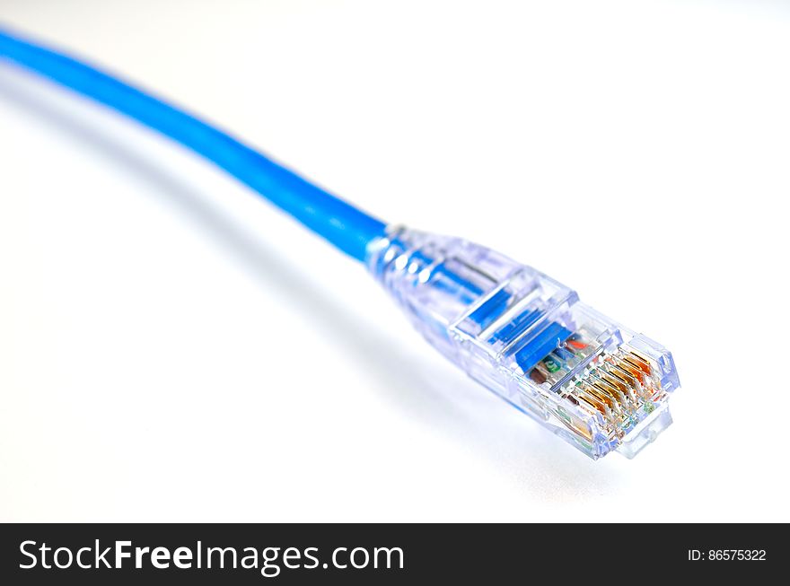 Close-up of Blue Ethernet Cable Against White Background