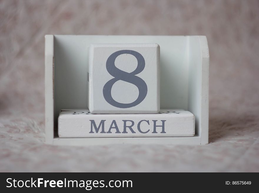Wooden calendar blocks displaying March 8 on desktop. Wooden calendar blocks displaying March 8 on desktop.