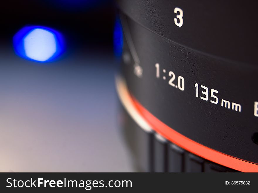 Close up of 135mm camera lens with bokeh light. Close up of 135mm camera lens with bokeh light.