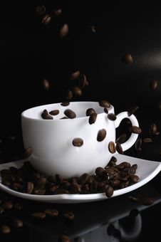 Coffee Cup With Failing Coffee Beans Royalty Free Stock Image Coffee Cup With Failing Coffee Beans Royalty Free Stock Image
