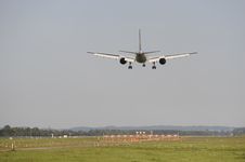 Airplane Is Landing At Airport Stock Photos