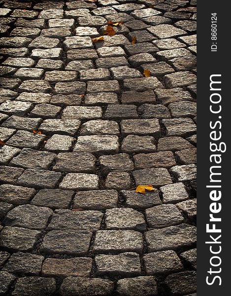 Aged cobblestone roadway. abstract background