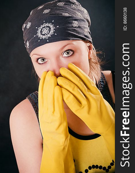 Young woman with yellow gloves