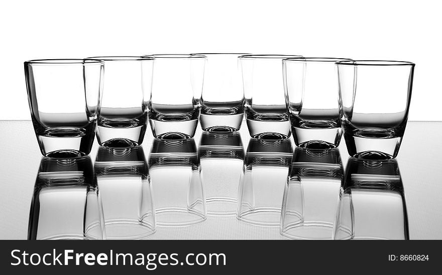 Set of the liquor-glasses on glass surface