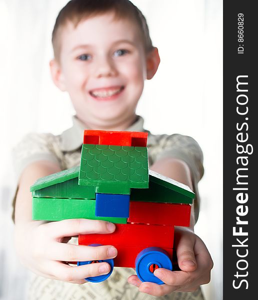 The child the boy plays  on a white background