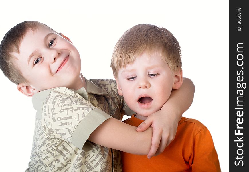 Two boys play on a white background. Two boys play on a white background