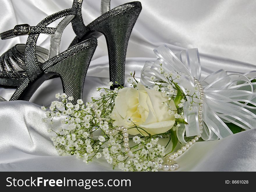 Silver high heels with rose bouquet and pearls. Silver high heels with rose bouquet and pearls.