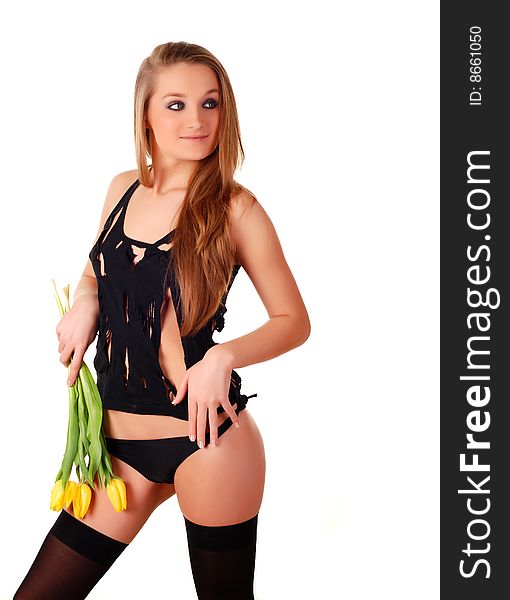 Beautiful woman in lingerie with bouquet of yellow tulips. Beautiful woman in lingerie with bouquet of yellow tulips