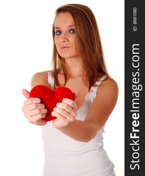 Young beatiful woman holding artificial red heart. Young beatiful woman holding artificial red heart