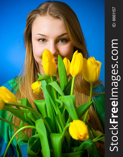 The young beautiful girl with tulips. The young beautiful girl with tulips
