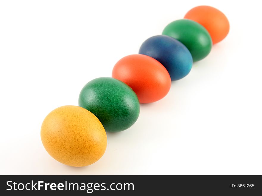 Six colored eggs isolated over white background. Six colored eggs isolated over white background