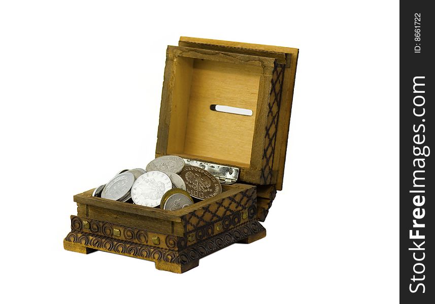 Open wooden vintage moneybox filled with silver shine and dull coins. Open wooden vintage moneybox filled with silver shine and dull coins