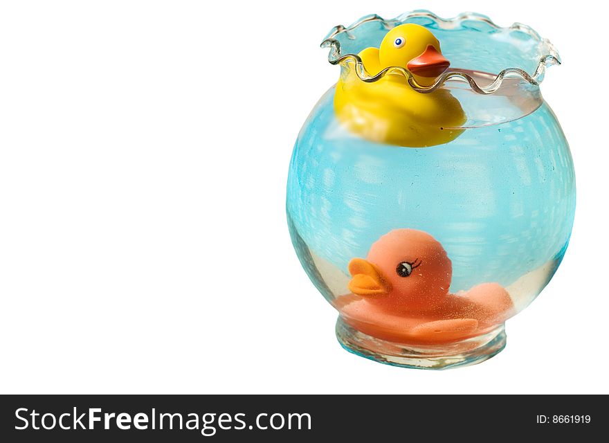 Two rubber duckies swimming in a blue vase
