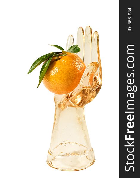 Glass ring-holder hand holding a tangerine. Glass ring-holder hand holding a tangerine