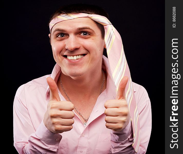 Funny man in pink shirt with necktie on his head