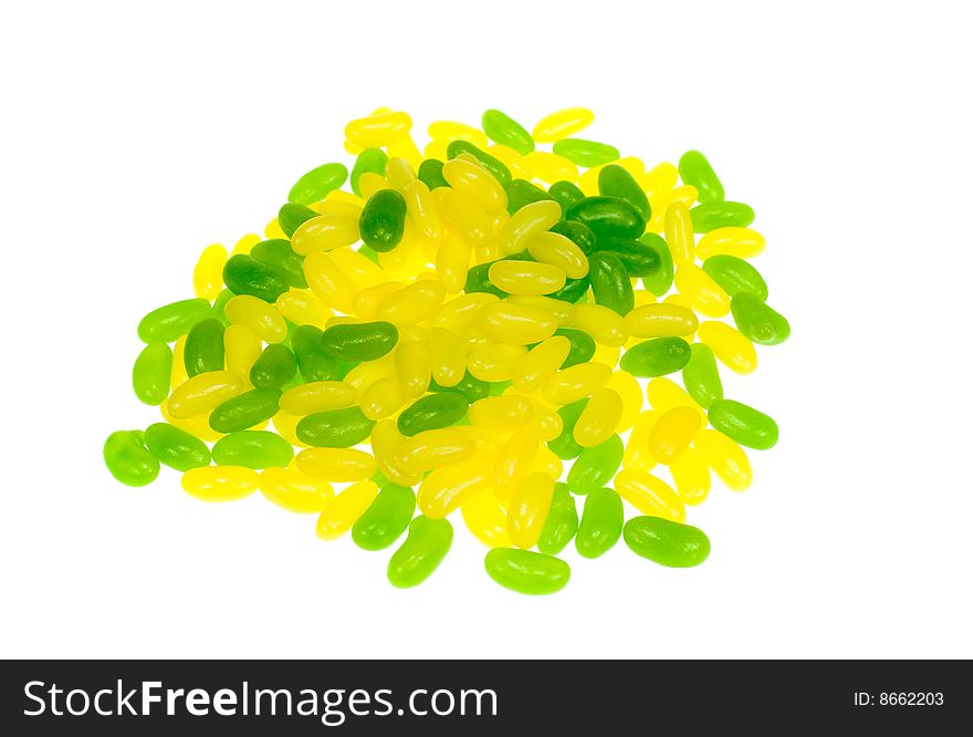 Green and yellow jelly beans isolated on a white background