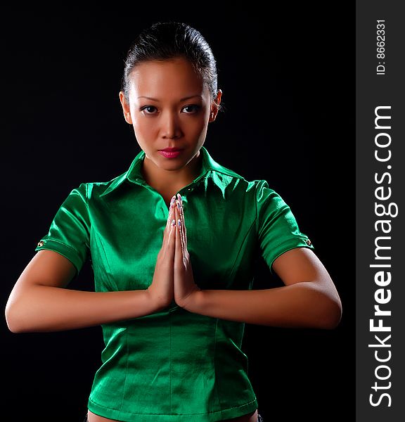 Portrait of a beautiful young woman in green shirt