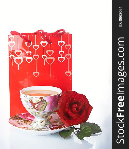 Red rose with coffee cups. Red rose with coffee cups