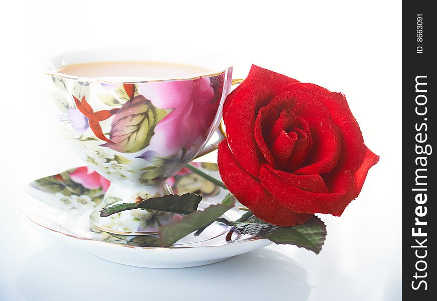 Red rose with coffee cups. Red rose with coffee cups