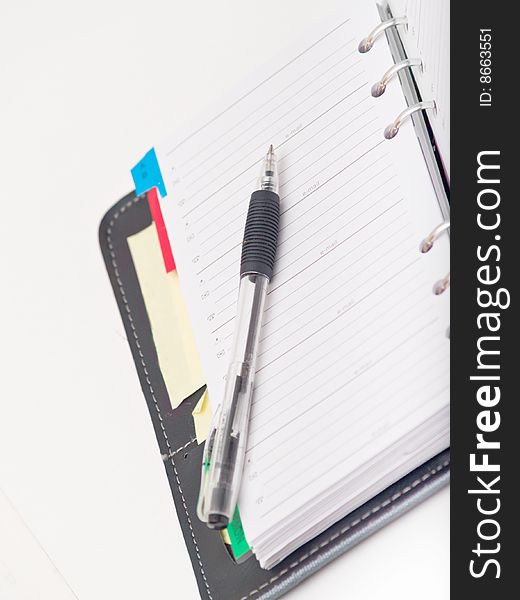 Office stationary - Pen and diary on white background
