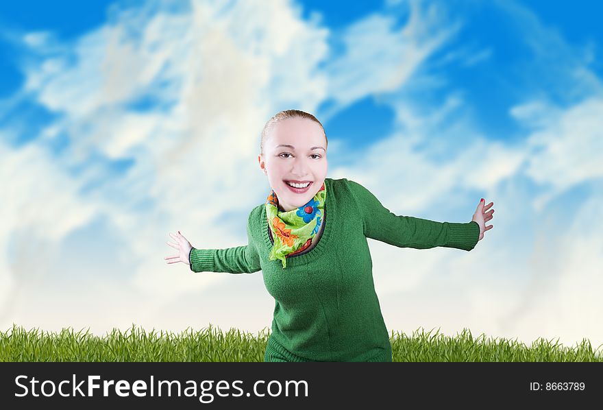 Happy smiling female wearing green cardigan against the blue sky and spring meadow. Happy smiling female wearing green cardigan against the blue sky and spring meadow