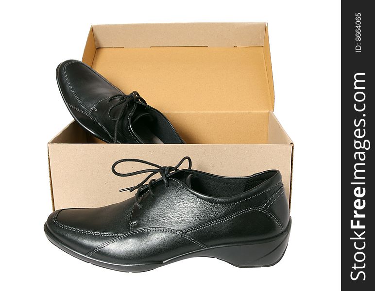 New black footwear in a box separately on a white background. New black footwear in a box separately on a white background