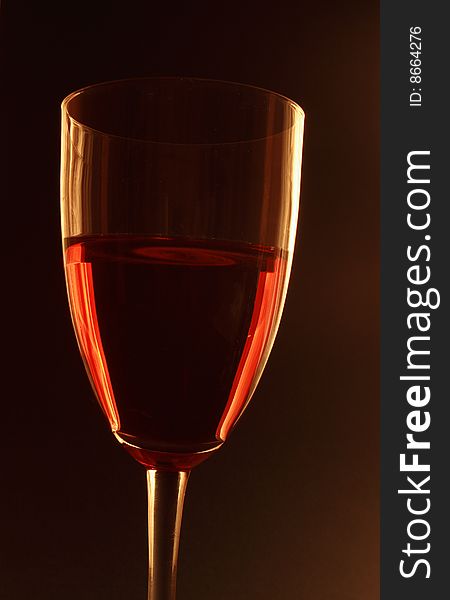 Red wine glass in back light. Red wine glass in back light