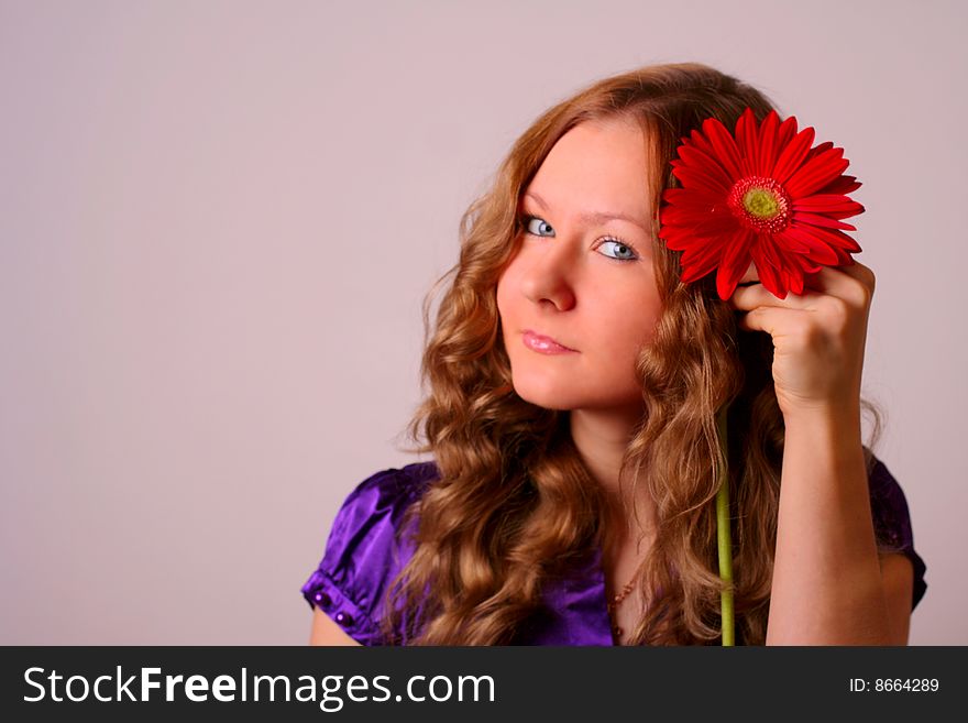 Girl and red flower on white