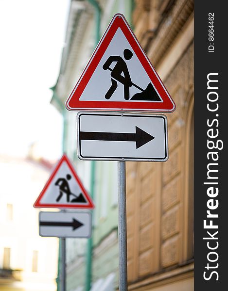 Double sign repair on a roadside. Double sign repair on a roadside.