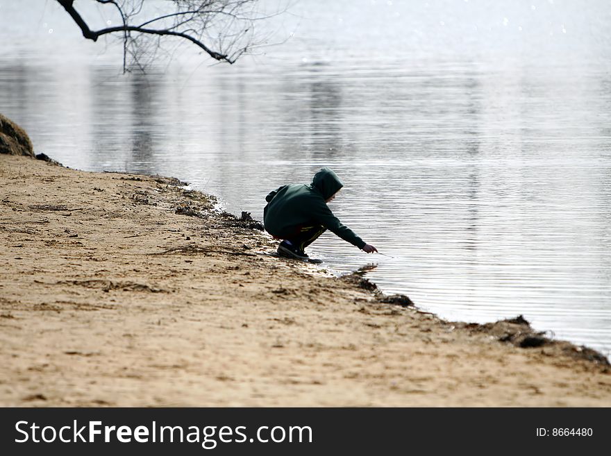 Young boy playing in the water. Young boy playing in the water