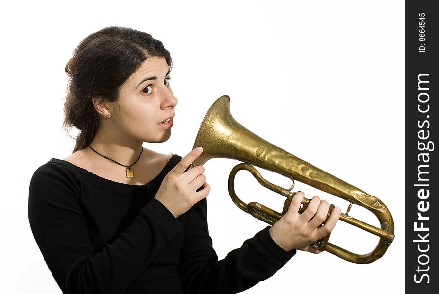 Young caucasian girl listen old trumpet