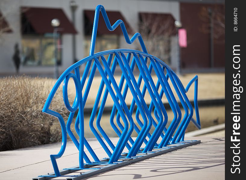 A public bicycle rack or stand designed in the shape of a fish. A public bicycle rack or stand designed in the shape of a fish.