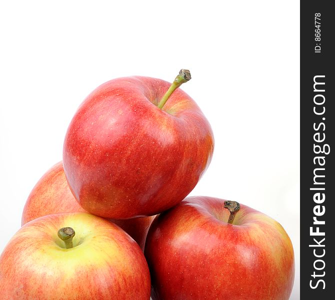 Apples arranged on a white background - staked