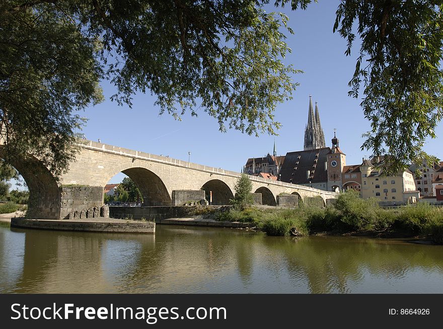 The famous old bridge and cathedral of Regensburg in Germany. The famous old bridge and cathedral of Regensburg in Germany