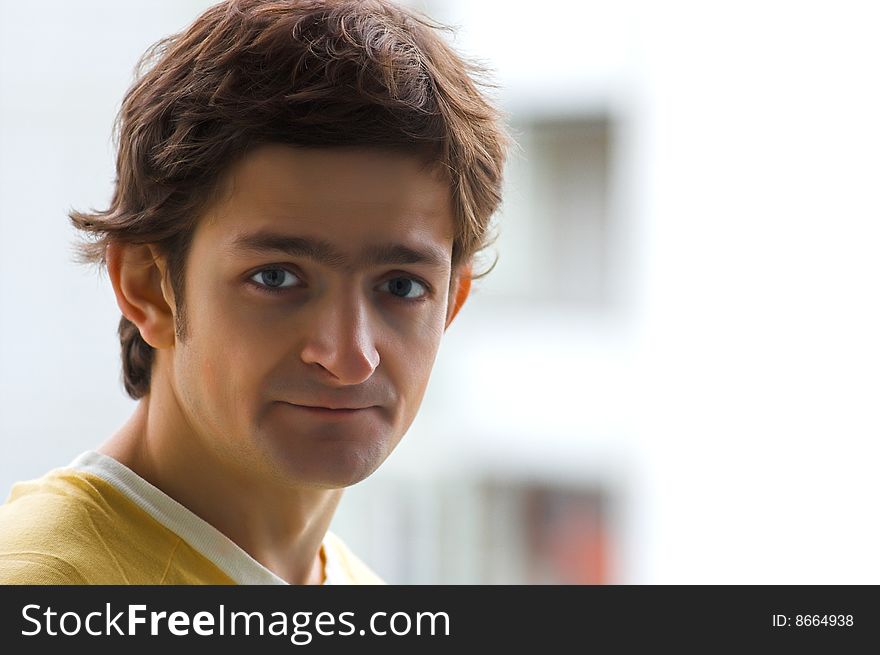 The young man in a yellow T-shirt.