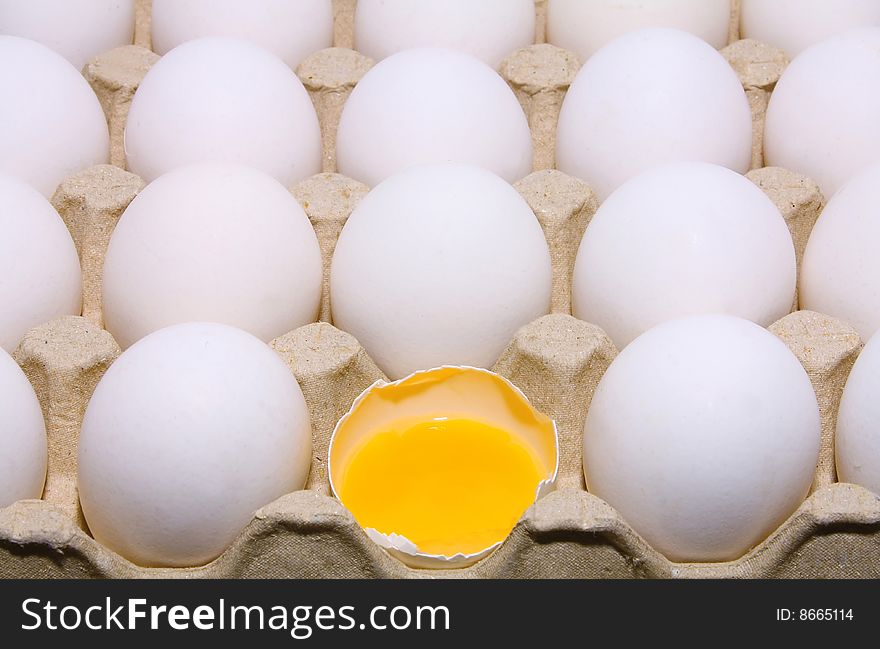 Much white raw eggs and yolk on tray. Much white raw eggs and yolk on tray
