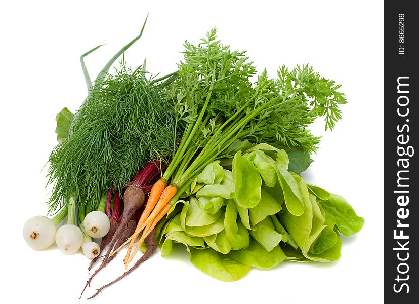 Close-up heap of new vegetables, isolated on white