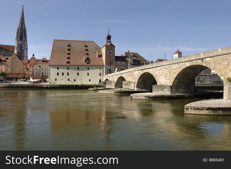 The famous old bridge and cathedral of Regensburg in Germany. The famous old bridge and cathedral of Regensburg in Germany