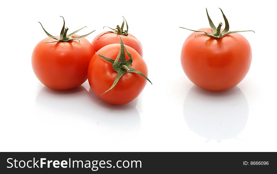 A group of tomatoes isolated on white background